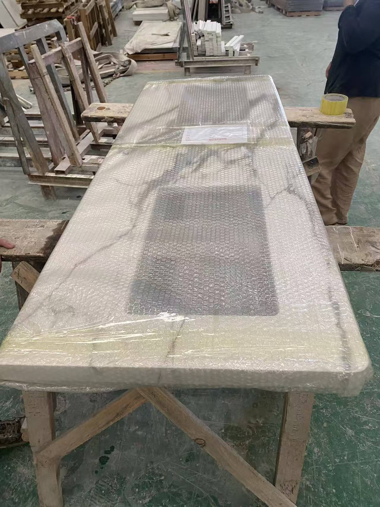 Countertop slab wrapped for protection on the factory floor